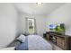 Cozy bedroom offers a calming atmosphere and a picturesque outdoor view at 511 Kenton Mill Ct, Rolesville, NC 27571