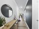 Welcoming hallway with stylish decor, accented by a round mirror and views into the living spaces at 511 Kenton Mill Ct, Rolesville, NC 27571