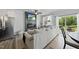 Comfortable living room features a modern fireplace and a stainless steel refrigerator at 511 Kenton Mill Ct, Rolesville, NC 27571