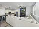 Open-concept living space connecting kitchen, living room, and fireplace at 511 Kenton Mill Ct, Rolesville, NC 27571