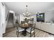 Open floor plan connects the staircase, dining area, living room, and kitchen at 511 Kenton Mill Ct, Rolesville, NC 27571