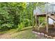 Well-maintained backyard and mature trees provide beauty and shade at 522 Johnson St, Garner, NC 27529