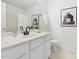 Well-maintained bathroom with a white vanity, black fixtures, and stylish decor at 522 Johnson St, Garner, NC 27529