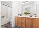 Well-lit bathroom featuring a double vanity with black fixtures and neutral finishes at 522 Johnson St, Garner, NC 27529