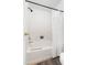 Clean white bathroom showcasing a bathtub with shower and elegant, neutral decor at 522 Johnson St, Garner, NC 27529