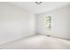 Bright, spacious bedroom with neutral carpet and a large window offering natural light at 522 Johnson St, Garner, NC 27529