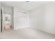 Cozy bedroom with neutral carpet and access to a connecting room, offering flexibility at 522 Johnson St, Garner, NC 27529