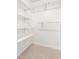 Walk-in closet with ample shelving and organizational space, carpet floor at 522 Johnson St, Garner, NC 27529