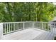 The open deck has ample space and a great view of mature trees at 522 Johnson St, Garner, NC 27529