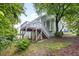 Exterior view of the rear deck, stairs, and backyard at 522 Johnson St, Garner, NC 27529
