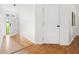 Bright foyer with hardwood floors and a view of the front door at 522 Johnson St, Garner, NC 27529