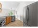 Efficient kitchen with stainless steel appliances, oak cabinets, and a bright open-concept dining area for easy entertaining at 522 Johnson St, Garner, NC 27529