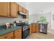 Traditional kitchen with stainless steel appliances and oak cabinets providing ample space for cooking and storage at 522 Johnson St, Garner, NC 27529
