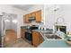 Cozy kitchen with wood cabinets, corner sink, and an adjoining open concept living area, perfect for modern living at 522 Johnson St, Garner, NC 27529