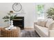 Cozy living room featuring a fireplace, neutral tones, and modern decor at 522 Johnson St, Garner, NC 27529