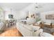 Cozy living room featuring modern furnishings, a ceiling fan, and hardwood floors for a comfortable and stylish home at 522 Johnson St, Garner, NC 27529