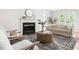 Living room featuring a fireplace, neutral tones, and modern decor at 522 Johnson St, Garner, NC 27529