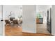 View of the living room with fireplace through a hallway to the kitchen at 522 Johnson St, Garner, NC 27529
