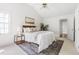 Spacious main bedroom with neutral tones and stylish decor, including modern lighting at 522 Johnson St, Garner, NC 27529