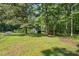 Large backyard features a storage shed and shelter at 5414 Ventoria Rd, Durham, NC 27712