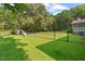 Level, fenced backyard with mature trees and a storage shed at 5414 Ventoria Rd, Durham, NC 27712