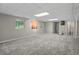 Spacious finished basement with carpeting, and windows at 5414 Ventoria Rd, Durham, NC 27712