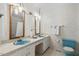 Bathroom with double sinks, decorative light fixture and a toilet at 5414 Ventoria Rd, Durham, NC 27712