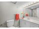 Bathroom with white vanity, modern fixtures, and framed mirror at 5414 Ventoria Rd, Durham, NC 27712