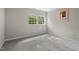 Cozy bedroom featuring neutral carpeting, a window, and a closet at 5414 Ventoria Rd, Durham, NC 27712