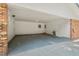 Spacious carport with brick columns and white-painted walls, providing ample parking and storage at 5414 Ventoria Rd, Durham, NC 27712