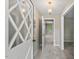 Light-filled entryway with glass front door, neutral walls, and open access to the main living area at 5414 Ventoria Rd, Durham, NC 27712