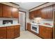 Traditional kitchen with wood cabinets, white countertops, and a layout perfect for cooking and storage at 5414 Ventoria Rd, Durham, NC 27712