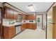 Traditional kitchen featuring wooden cabinets and bright countertops offers ample counter space at 5414 Ventoria Rd, Durham, NC 27712