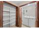 Functional laundry room with washer, dryer, and built-in shelving for convenient storage at 5414 Ventoria Rd, Durham, NC 27712