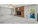 Inviting living area with fireplace, neutral carpet and light walls; screened-in porch access at 5414 Ventoria Rd, Durham, NC 27712