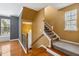 Carpeted staircase leading to the upper level, with nearby hardwood flooring at 5503 Silver Moon Ln, Raleigh, NC 27606