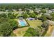 Aerial view of a community pool with lounge chairs and plenty of green space at 5712 Turner Store Ln, Raleigh, NC 27603