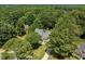 Overhead view shows home surrounded by mature trees with pool, deck, and gazebo at 5712 Turner Store Ln, Raleigh, NC 27603