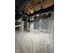 Bright basement featuring clean, white vapor barrier, insulated walls, and visible utilities at 5712 Turner Store Ln, Raleigh, NC 27603
