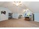 Spacious upper-level bedroom with sloped ceilings, natural light, a ceiling fan, and comfortable furnishings at 5712 Turner Store Ln, Raleigh, NC 27603