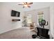 Cozy bedroom featuring neutral walls, ceiling fan, natural light, and space for a workout area at 5712 Turner Store Ln, Raleigh, NC 27603