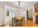 Cozy dining area with decorative lighting situated adjacent to kitchen with easy access at 5712 Turner Store Ln, Raleigh, NC 27603