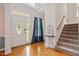 Bright foyer features hardwood floors, a staircase, and decorative accents at 5712 Turner Store Ln, Raleigh, NC 27603