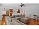Spacious living room with hardwood floors and large, comfortable sectional sofa at 5712 Turner Store Ln, Raleigh, NC 27603