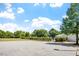 Well-maintained parking lot surrounded by lush greenery and blue sky, offering convenient access at 5712 Turner Store Ln, Raleigh, NC 27603