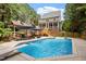 Inviting in-ground pool and backyard is ideal for fun and relaxation at 5712 Turner Store Ln, Raleigh, NC 27603