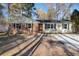 Charming single-story home featuring brick accents, black shutters, and a well-maintained front yard at 5917 Meadowlark Ln, Raleigh, NC 27610