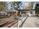 Charming single-story home featuring brick accents, black shutters, and a well-maintained front yard at 5917 Meadowlark Ln, Raleigh, NC 27610