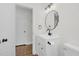 Modern bathroom features vanity with a mirror, lighting and dark hardware at 631 Park Ave, Rocky Mount, NC 27801
