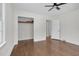 Bright bedroom features hardwood floors, a ceiling fan, and a closet at 631 Park Ave, Rocky Mount, NC 27801